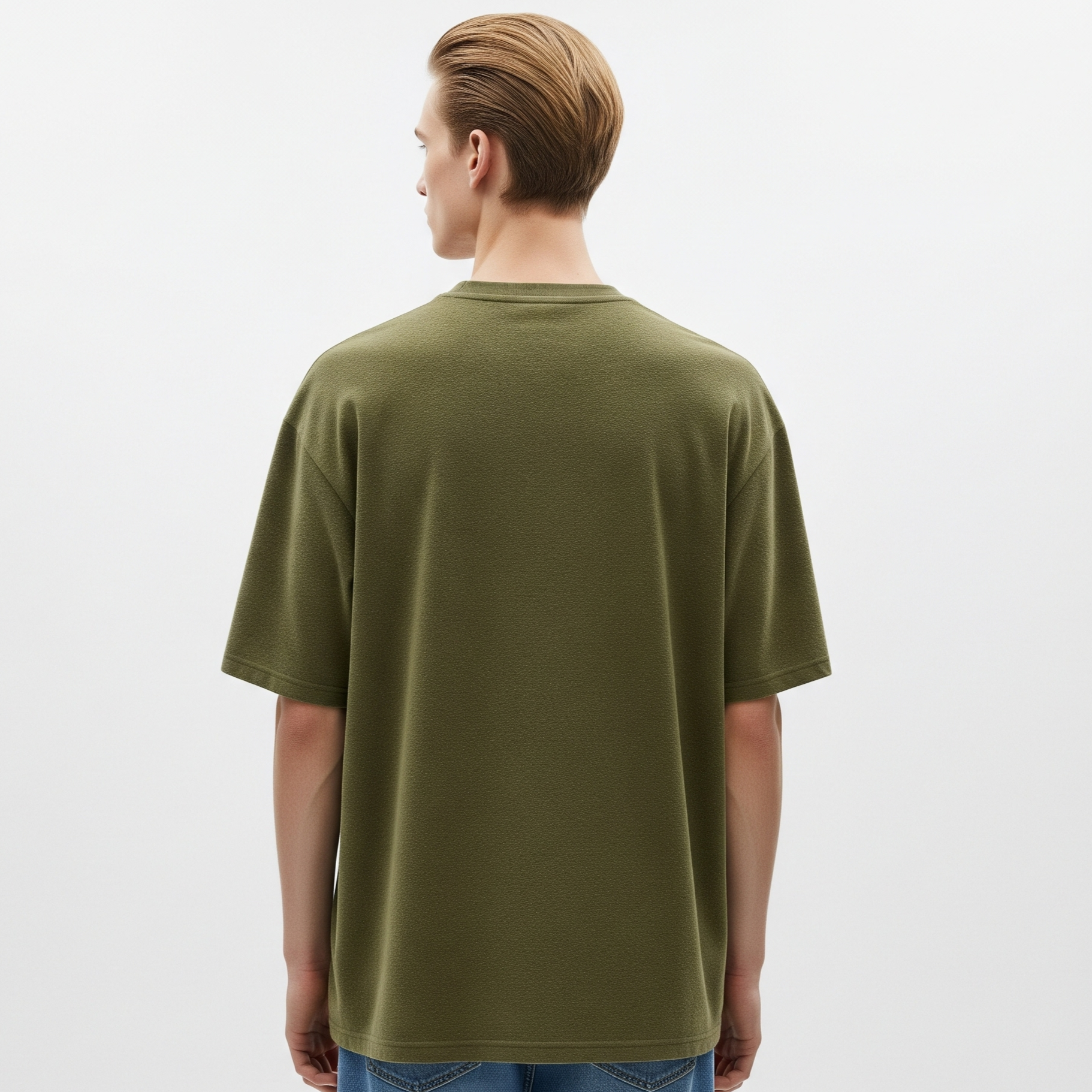 Person wearing an olive green t-shirt on a white background